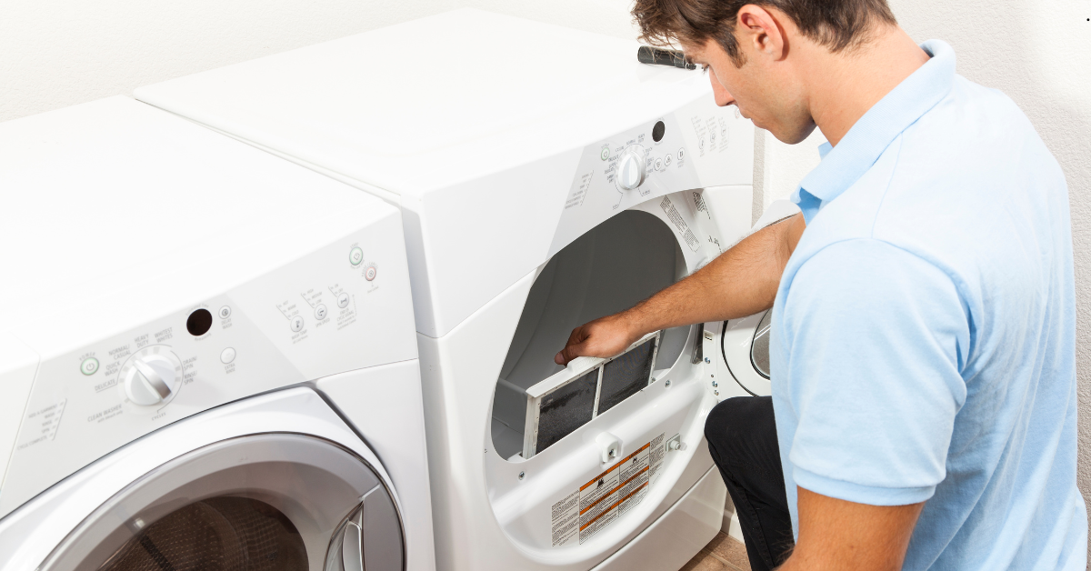 Technician repairing a dryer